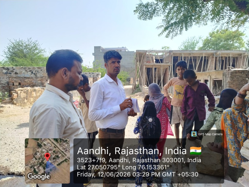 NGO team conducting need assessments with local children in Aandhi village, Rajasthan
